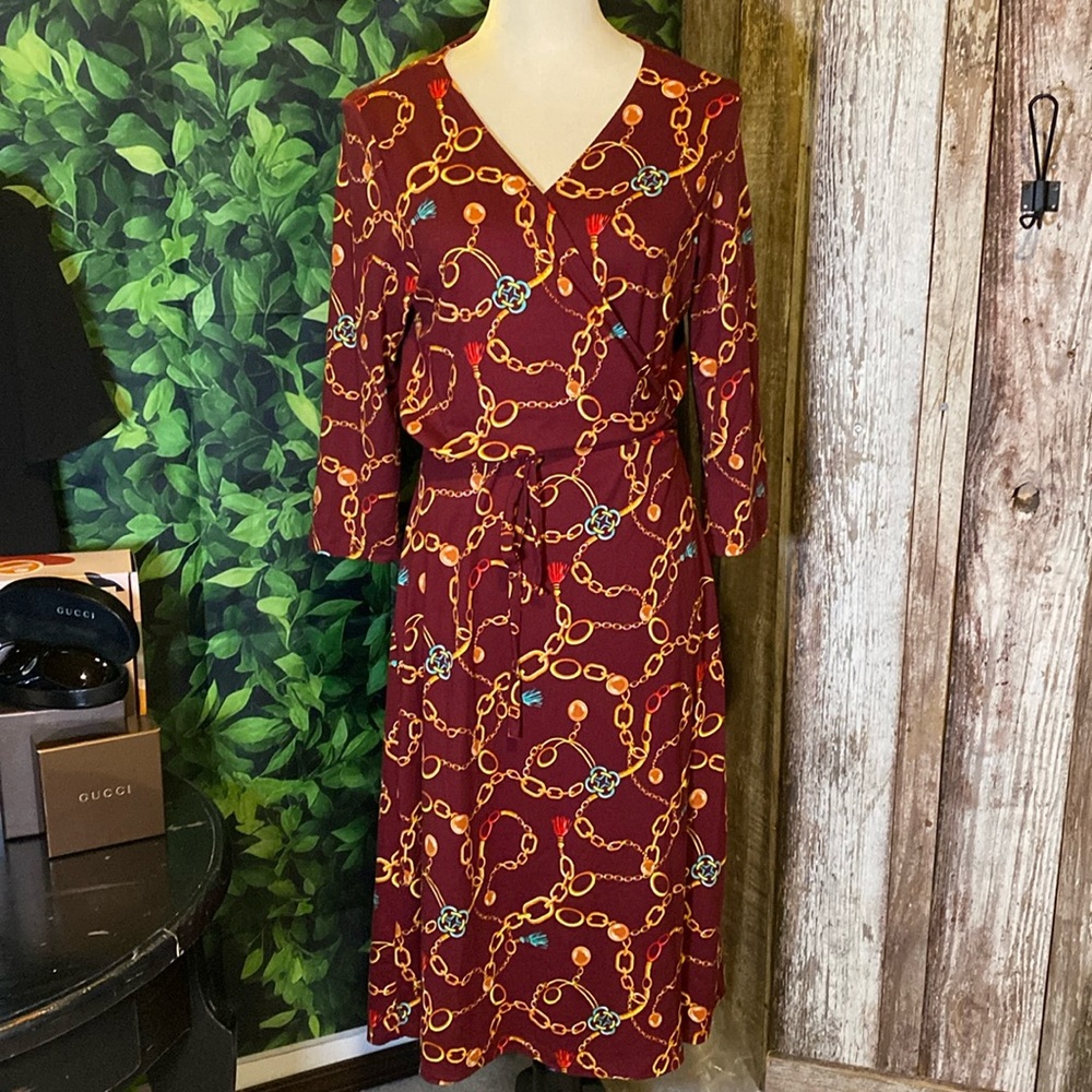 Wrap around midi dress. Gold chain pattern against red wine. Very festive